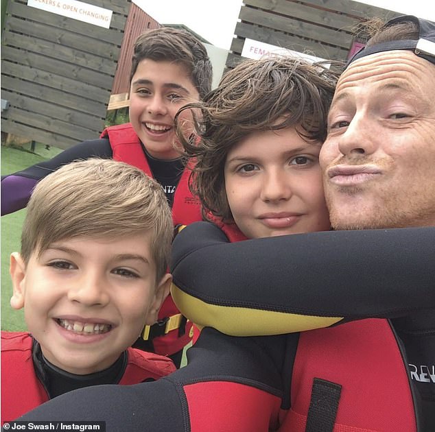 Loving life: The former Dancing On Ice winner explained that now everyone has realised there's 'no threat,' their boys couldn't be happier