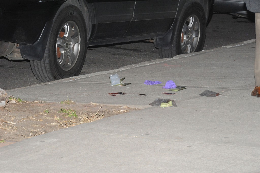 Evidence is collected at the scene of the shooting.